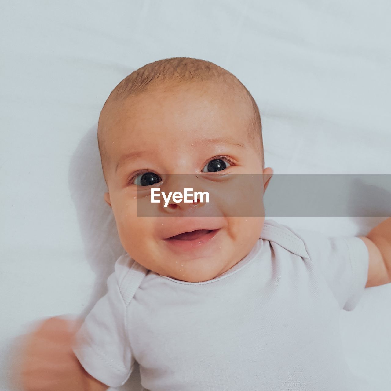 PORTRAIT OF CUTE BABY SMILING