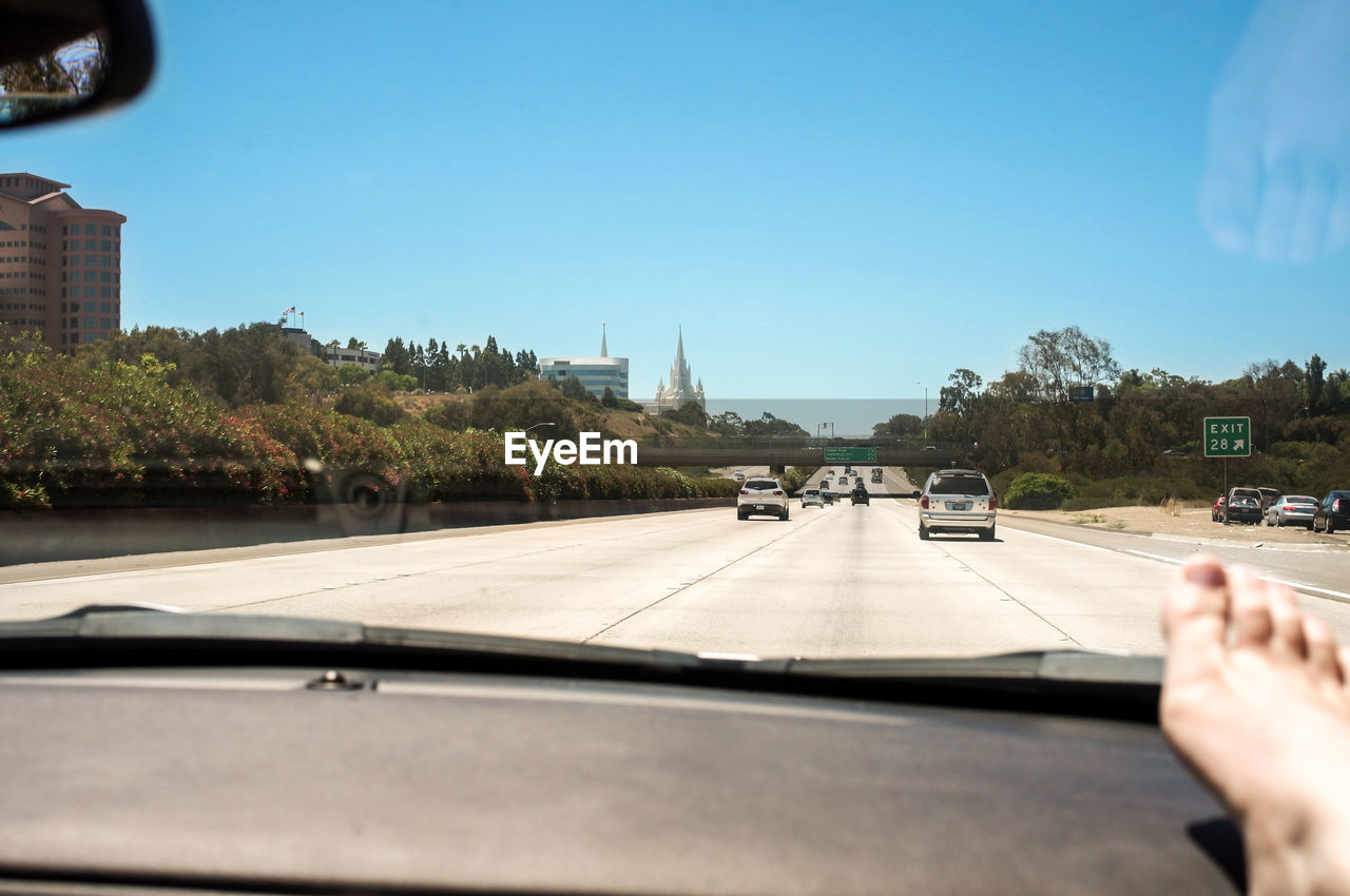 Cropped image of car on road