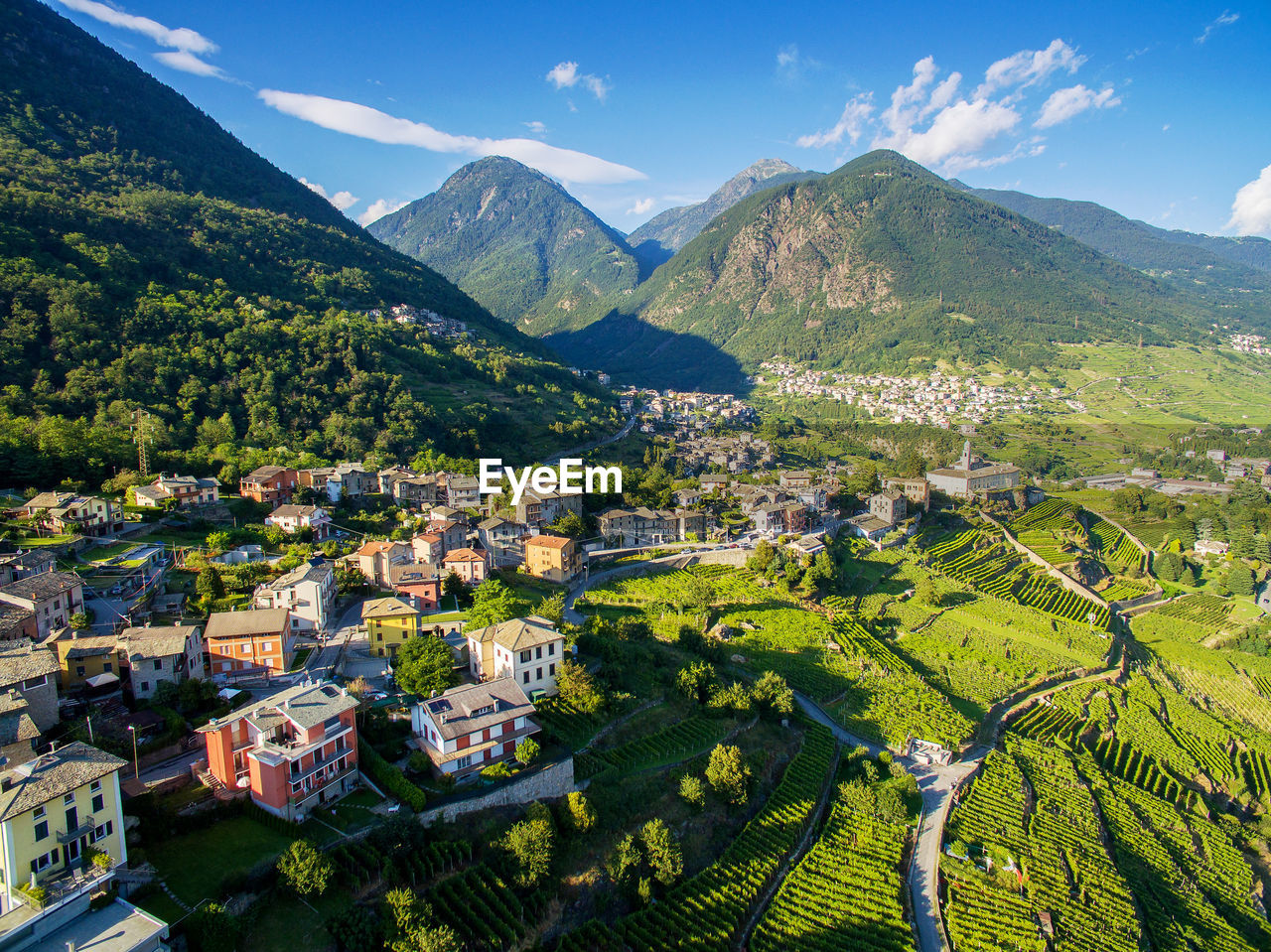 AERIAL VIEW OF TOWNSCAPE BY MOUNTAINS