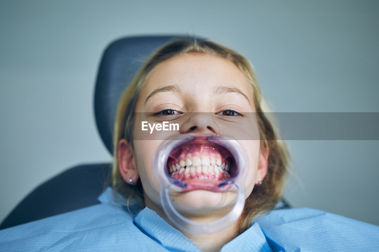 Close-up portrait of girl at dentist office