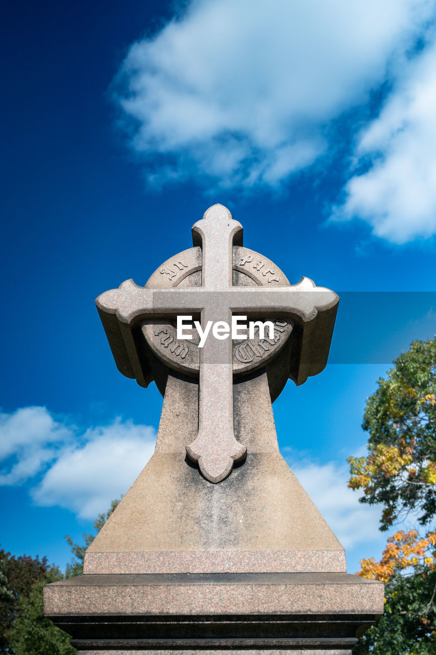 sky, cloud, religion, belief, blue, nature, architecture, spirituality, no people, cross, sculpture, plant, monument, cemetery, history, grave, the past, tombstone, outdoors, day, statue, tree, craft, death, travel destinations, stone material, memorial, place of worship