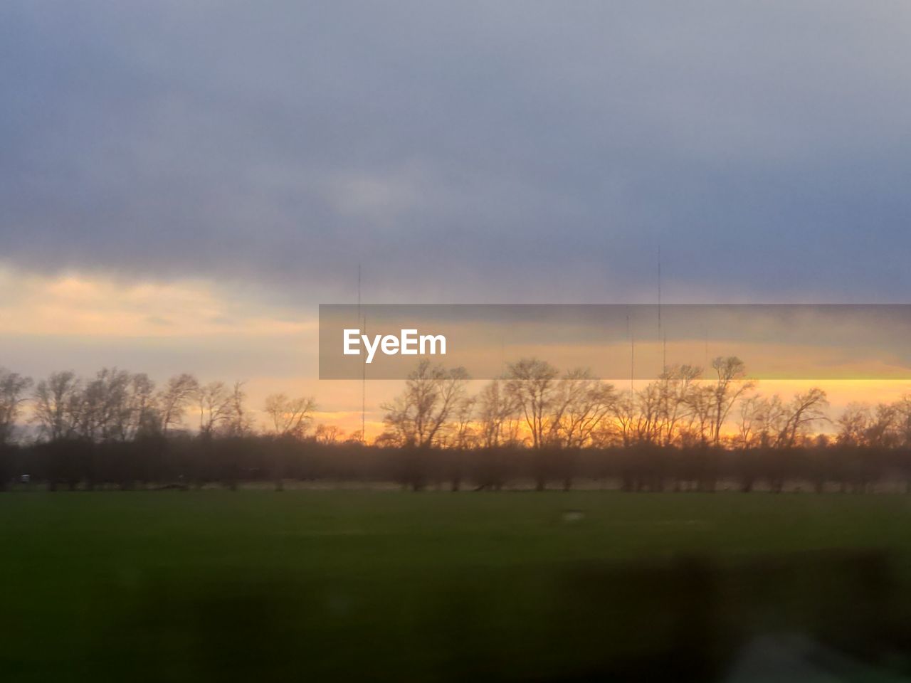 SCENIC VIEW OF FIELD AGAINST SKY DURING SUNSET