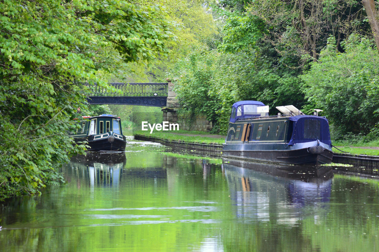 BOAT MOORED IN LAKE