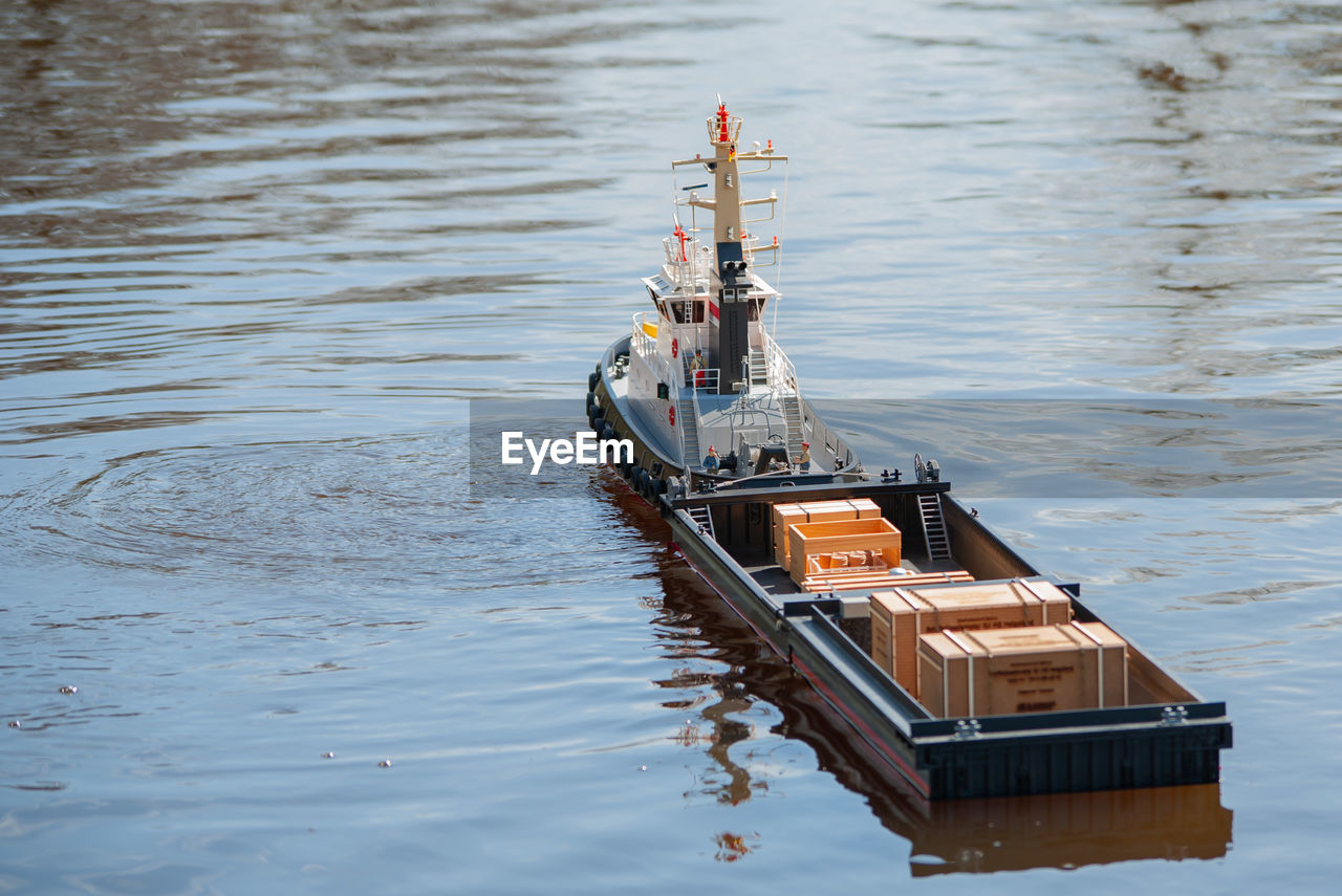 Remote controlled ship model is remote controlled on a lake