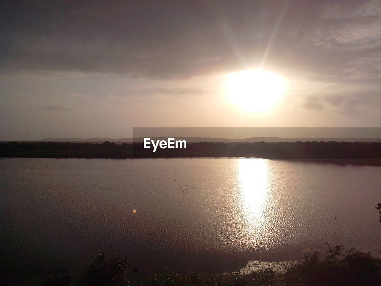 SUNSET OVER RIVER