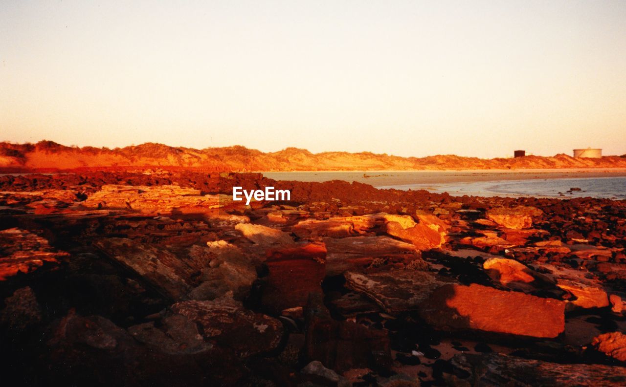 SCENIC VIEW OF ROCK FORMATIONS AGAINST CLEAR SKY