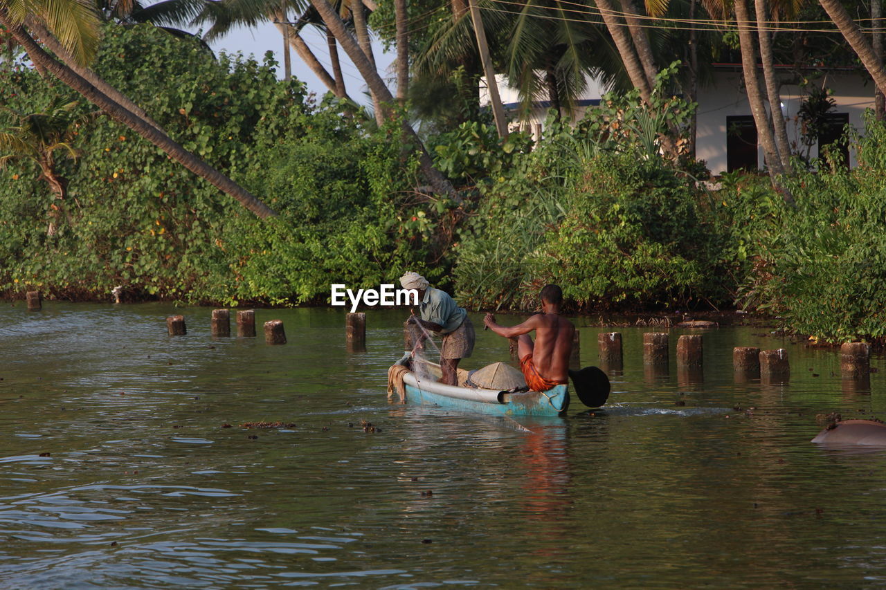 PEOPLE WALKING ON THE RIVER