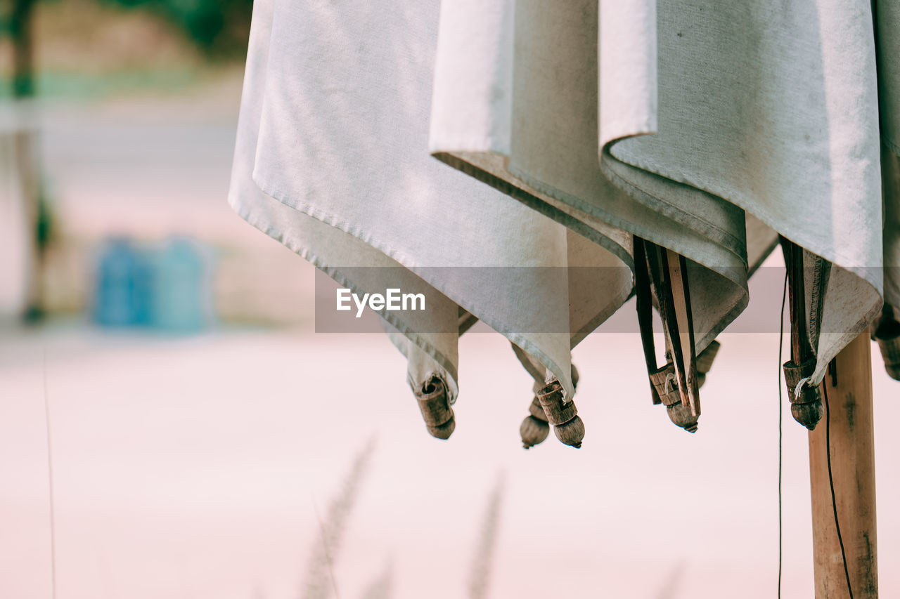 Close-up of chain hanging against blurred background