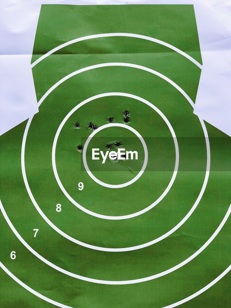 Direct view of a shooting target sheet used during a shooting training session 