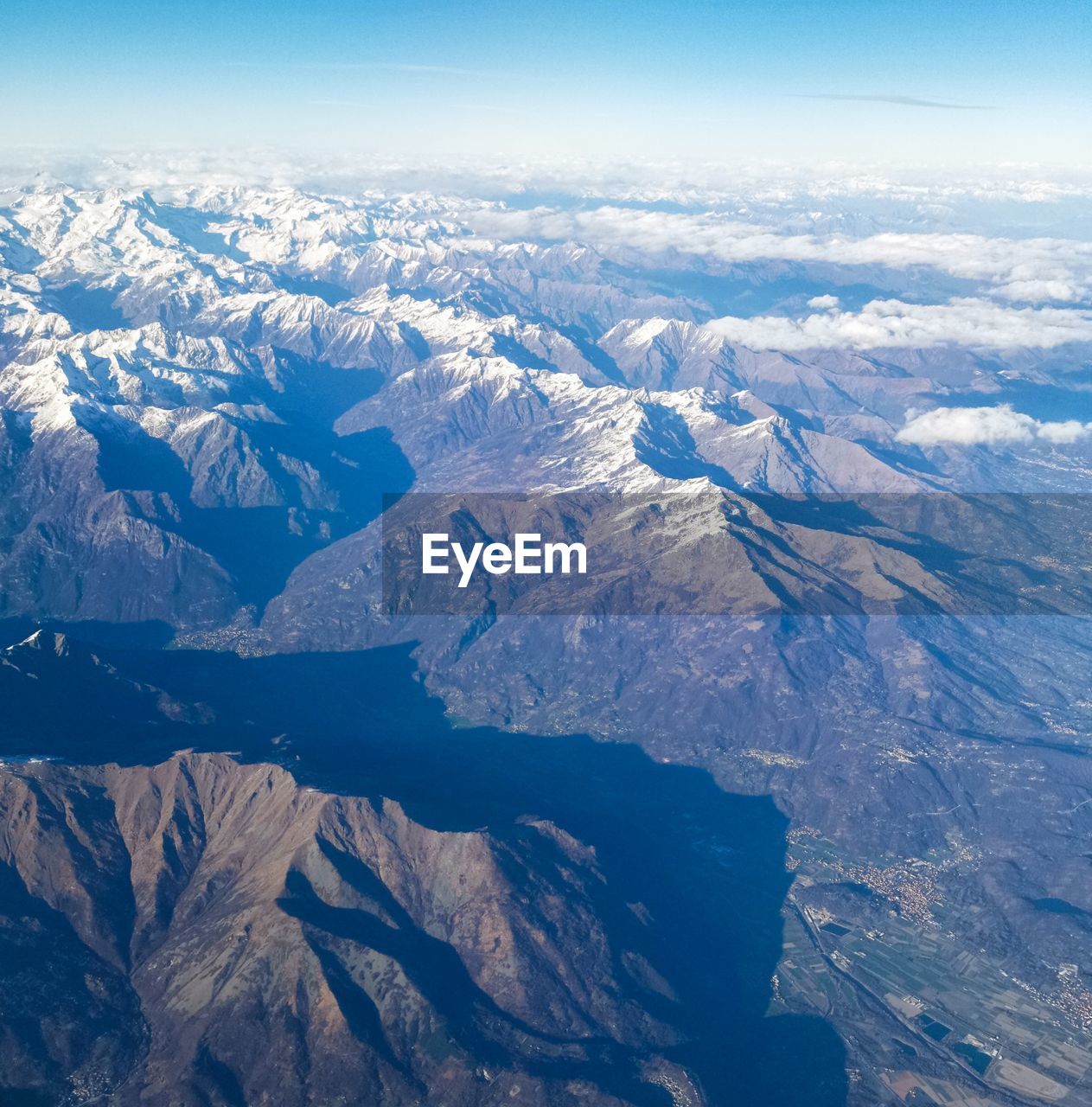 AERIAL VIEW OF DRAMATIC LANDSCAPE AGAINST SKY