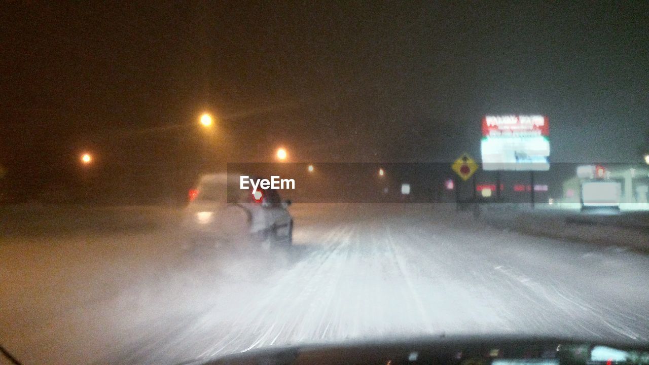 CARS ON ROAD AT NIGHT