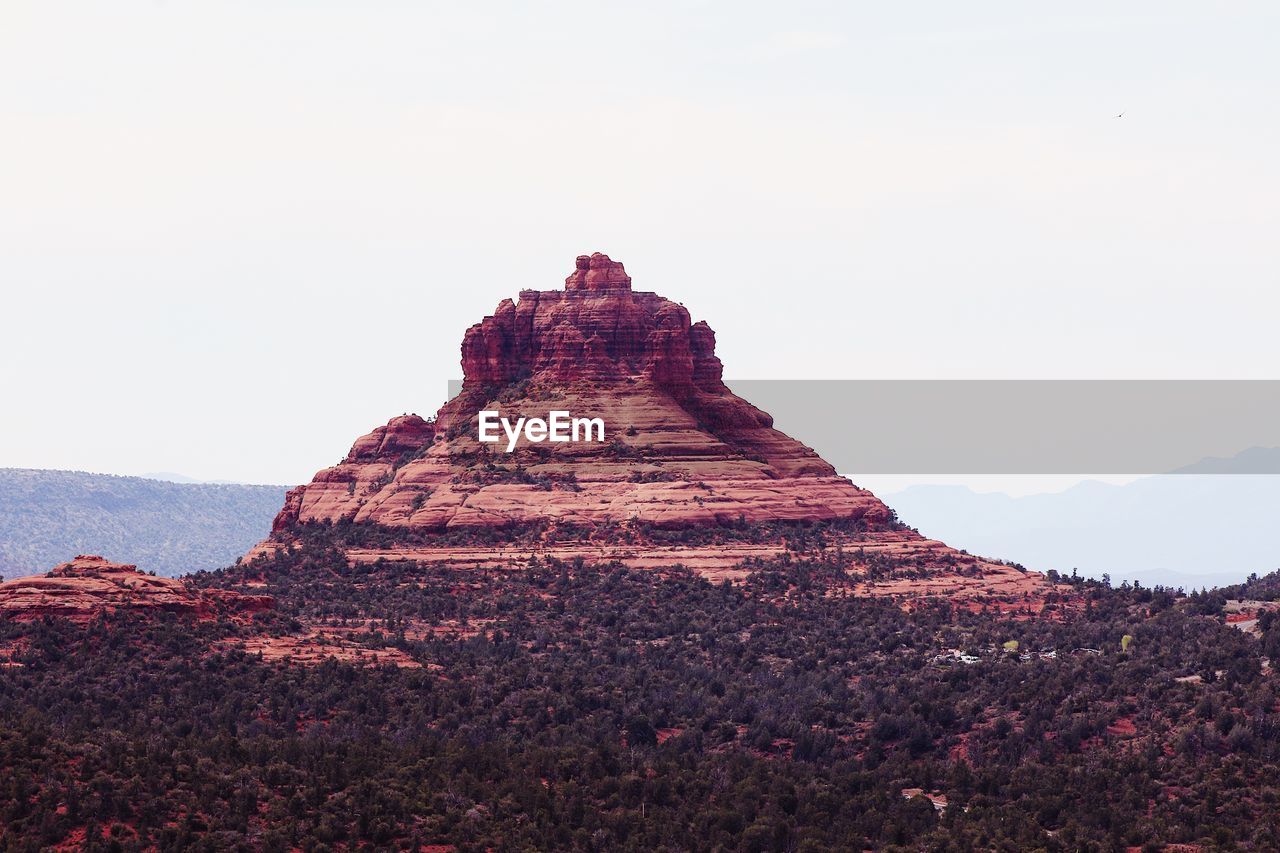 Rock formations on landscape against clear sky