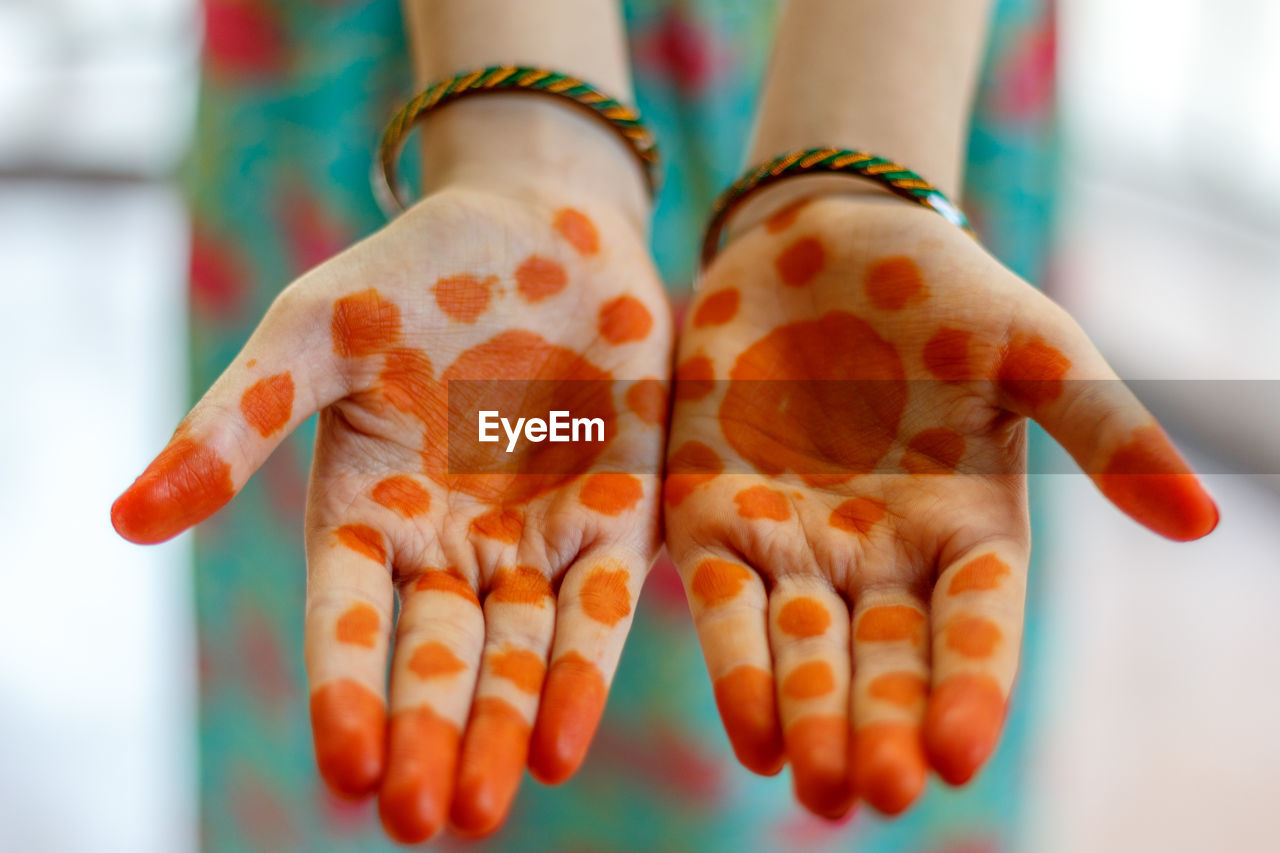 Close-up of woman with henna tattoo