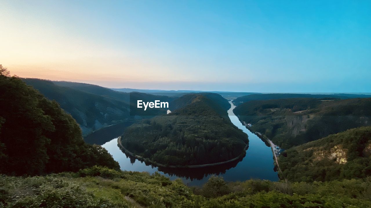 scenics - nature, sky, environment, beauty in nature, landscape, nature, mountain, water, tranquility, no people, land, tranquil scene, plant, tree, non-urban scene, travel destinations, travel, mountain range, blue, outdoors, sunset, idyllic, reflection, wilderness, forest, day, tourism, cloud, lake, sunlight, panoramic, clear sky, high angle view