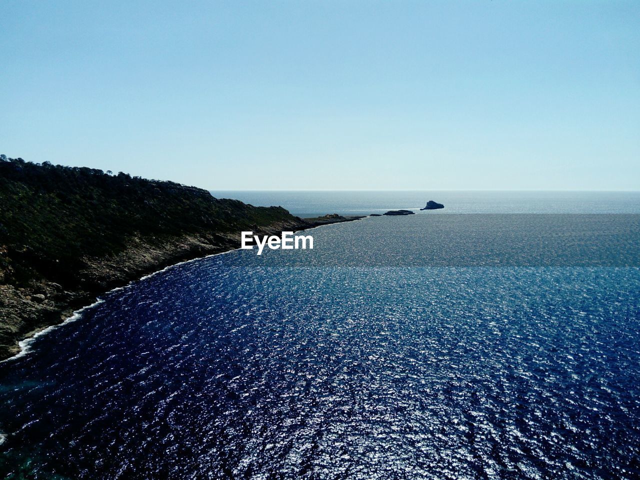 SCENIC VIEW OF BLUE SEA AGAINST CLEAR SKY