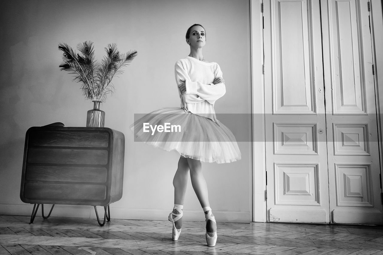 white, black and white, one person, fashion, monochrome photography, monochrome, women, young adult, full length, indoors, adult, elegance, dress, footwear, dancing, female, shoe, black, clothing, person, arts culture and entertainment, portrait, standing, furniture, retro styled, ballet, ballet tutu, glamour, chair, ballet dancer