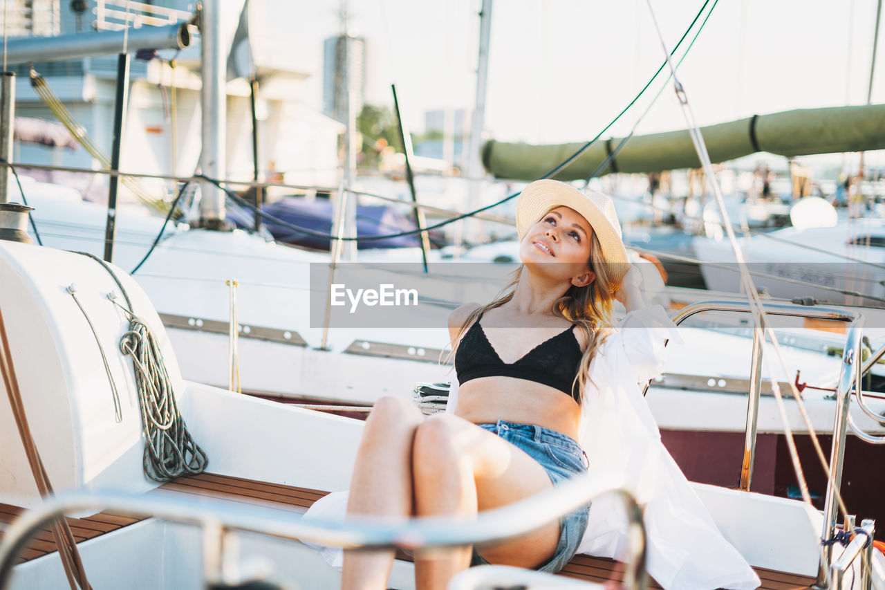 Woman sitting on a boat in sea