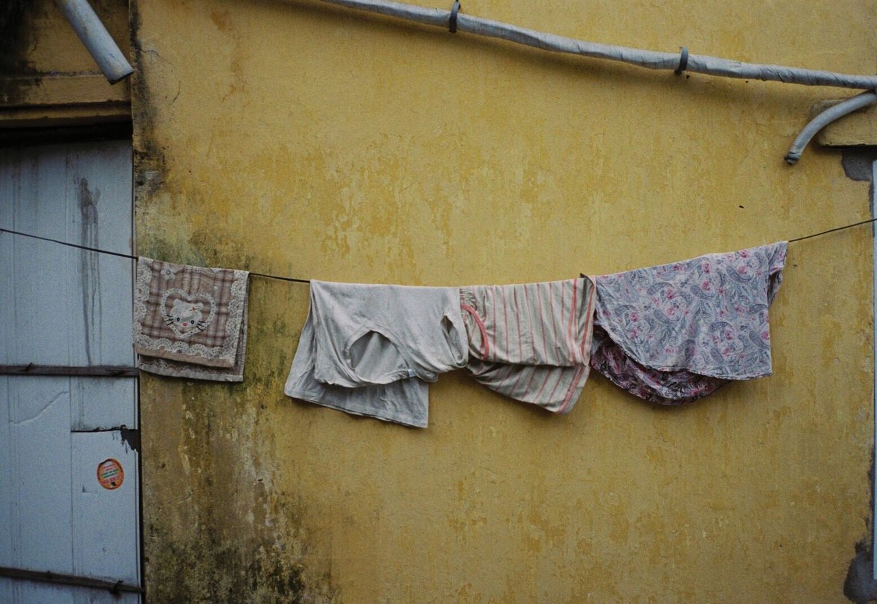 CLOTHES DRYING AGAINST BUILDING