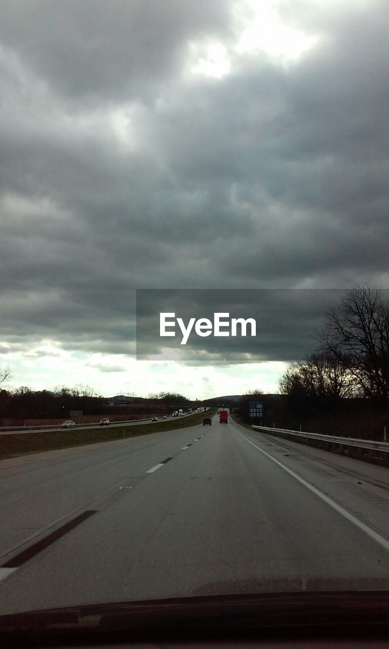 VIEW OF ROAD AGAINST CLOUDY SKY