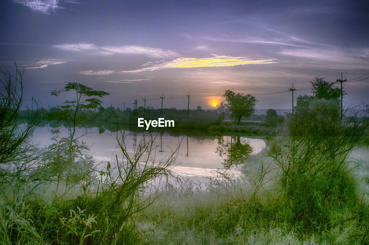 SCENIC VIEW OF LAKE DURING SUNSET