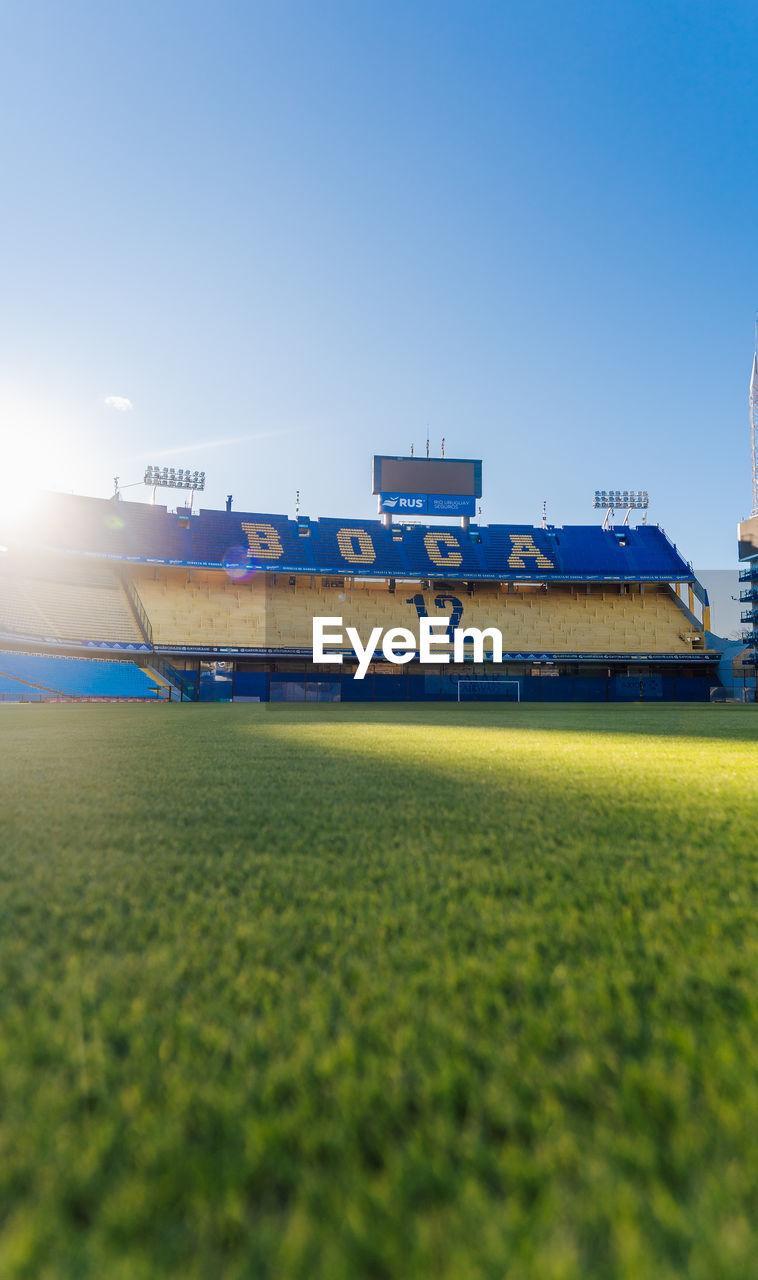 VIEW OF FIELD AGAINST CLEAR SKY