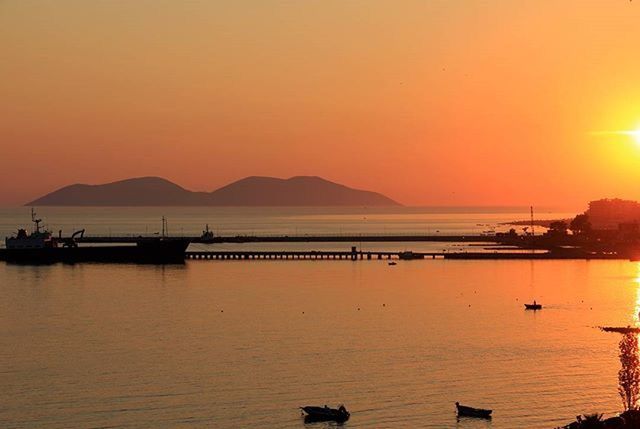 SCENIC VIEW OF SUNSET OVER SEA