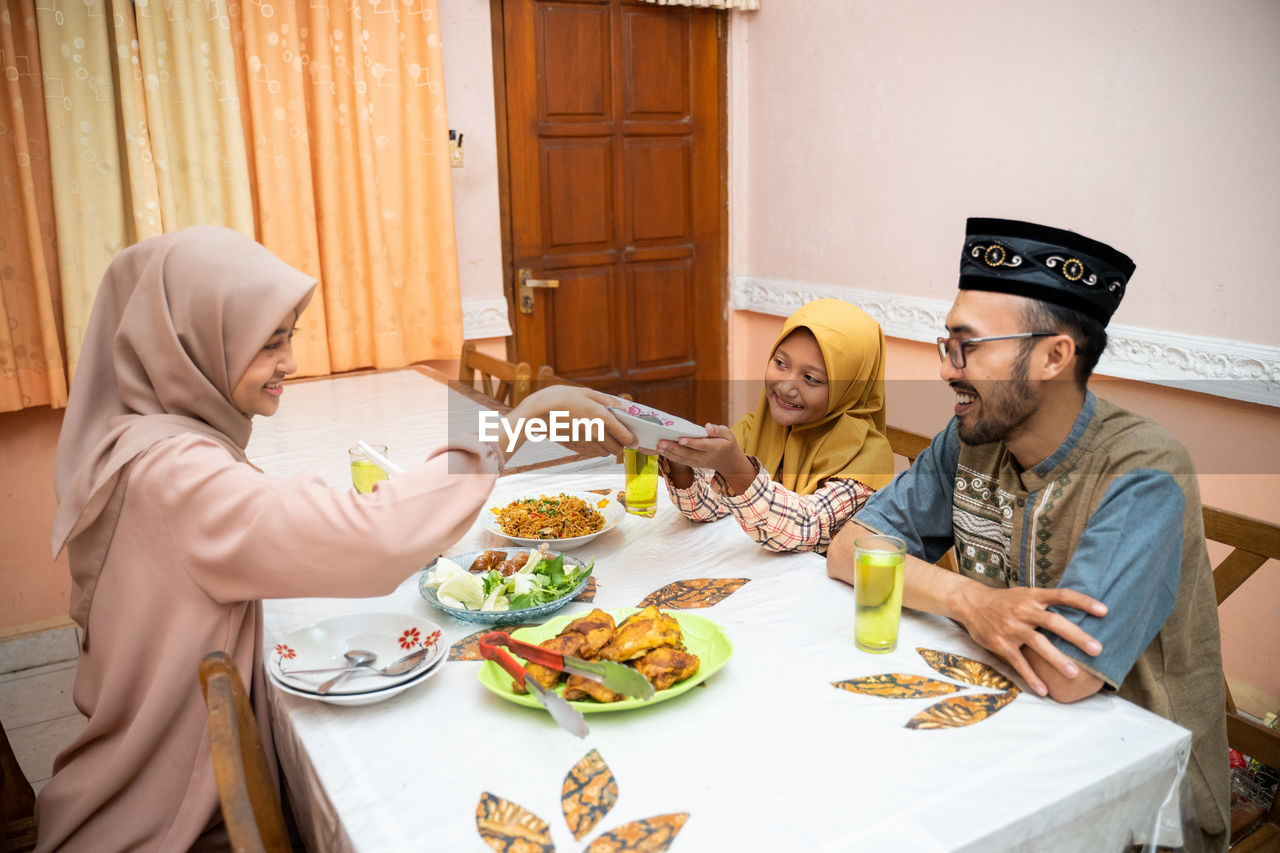 Happy family celebrating eid at home
