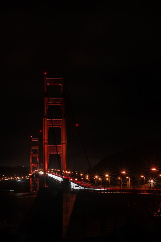 VIEW OF ILLUMINATED CITY AT NIGHT