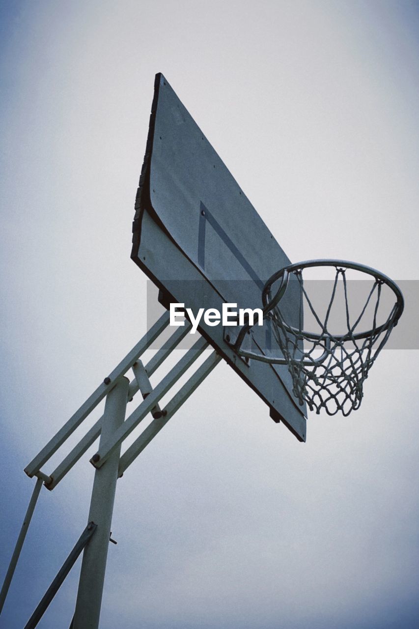 Low angle view of basketball hoop against sky