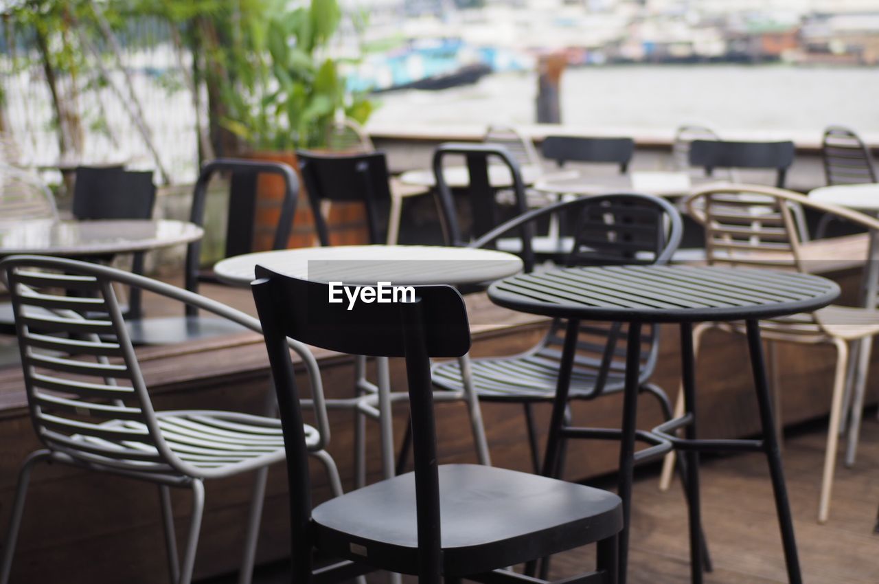 Empty chairs and table at cafe