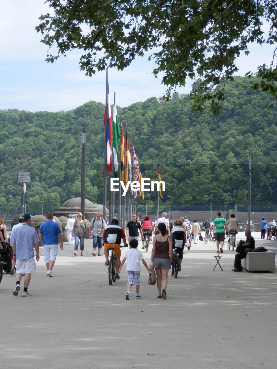 People on street against sky