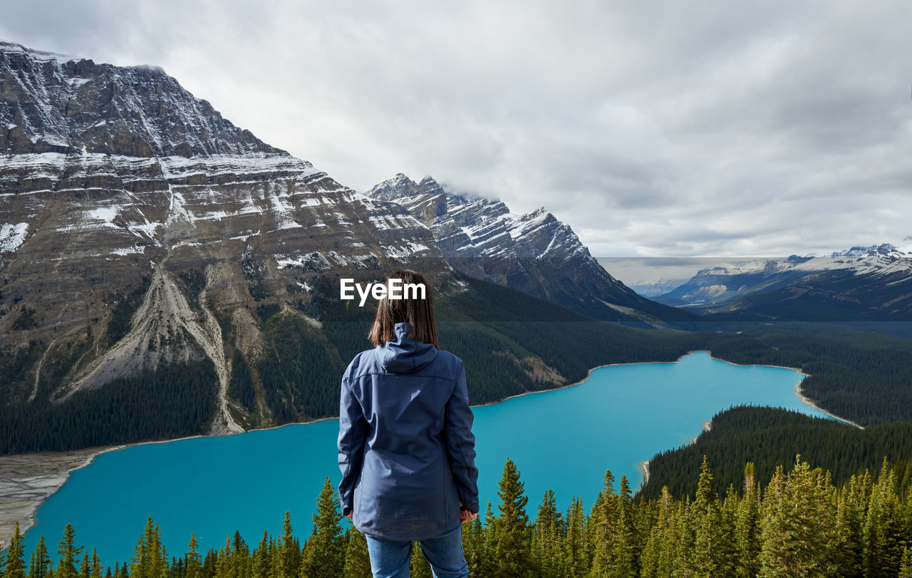 Girl enjoying the view on a hike at peyto lake, banff national park