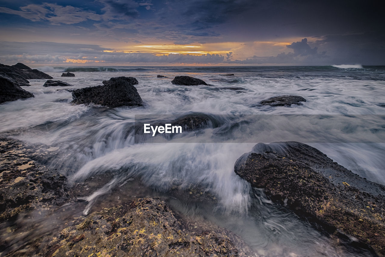 Scenic view of sea against sky during sunset