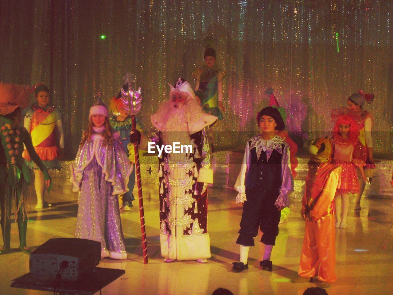 Children in costumes performing on stage