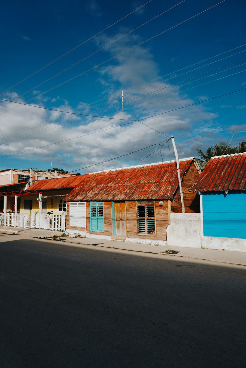 architecture, sky, built structure, building exterior, building, cloud, house, nature, blue, roof, city, sea, no people, residential district, land, horizon, outdoors, transportation, road, water, day, technology, street, beach, environment, evening, landscape, electricity