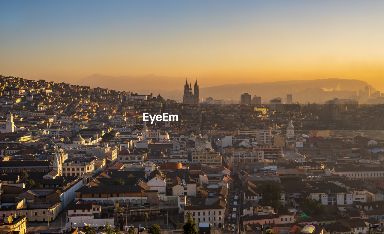 High angle view of city against sky during sunrise quito 