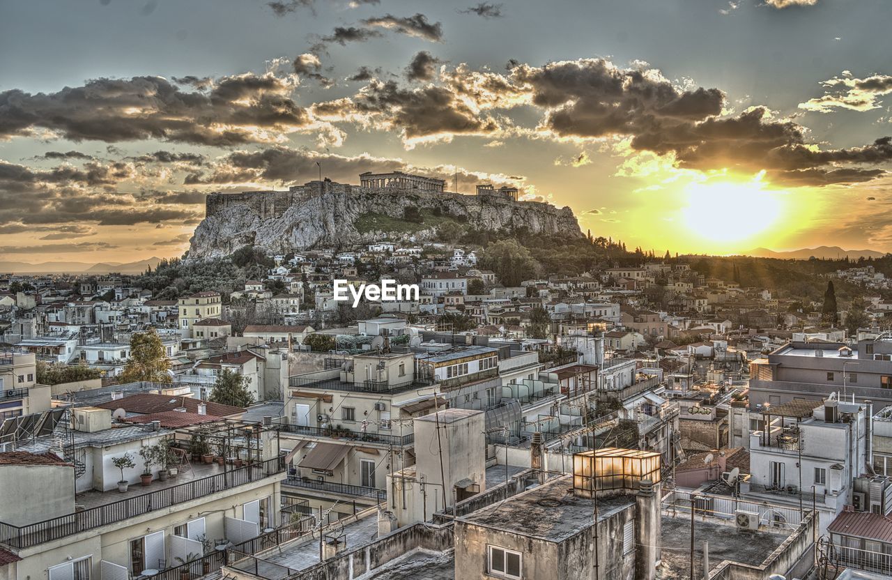 HIGH ANGLE VIEW OF TOWNSCAPE AGAINST SKY DURING SUNSET