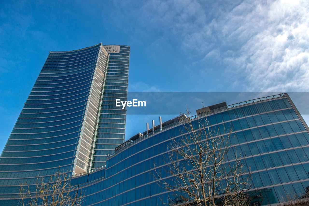 Low angle view of modern buildings against sky