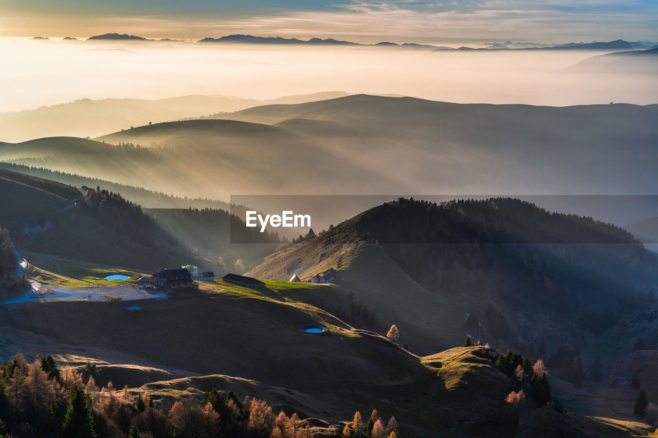 Scenic view of mountains against sky during sunset