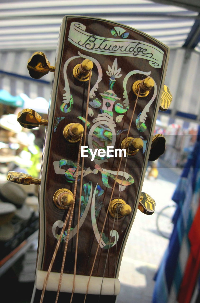 Cropped image of guitar headstock at market