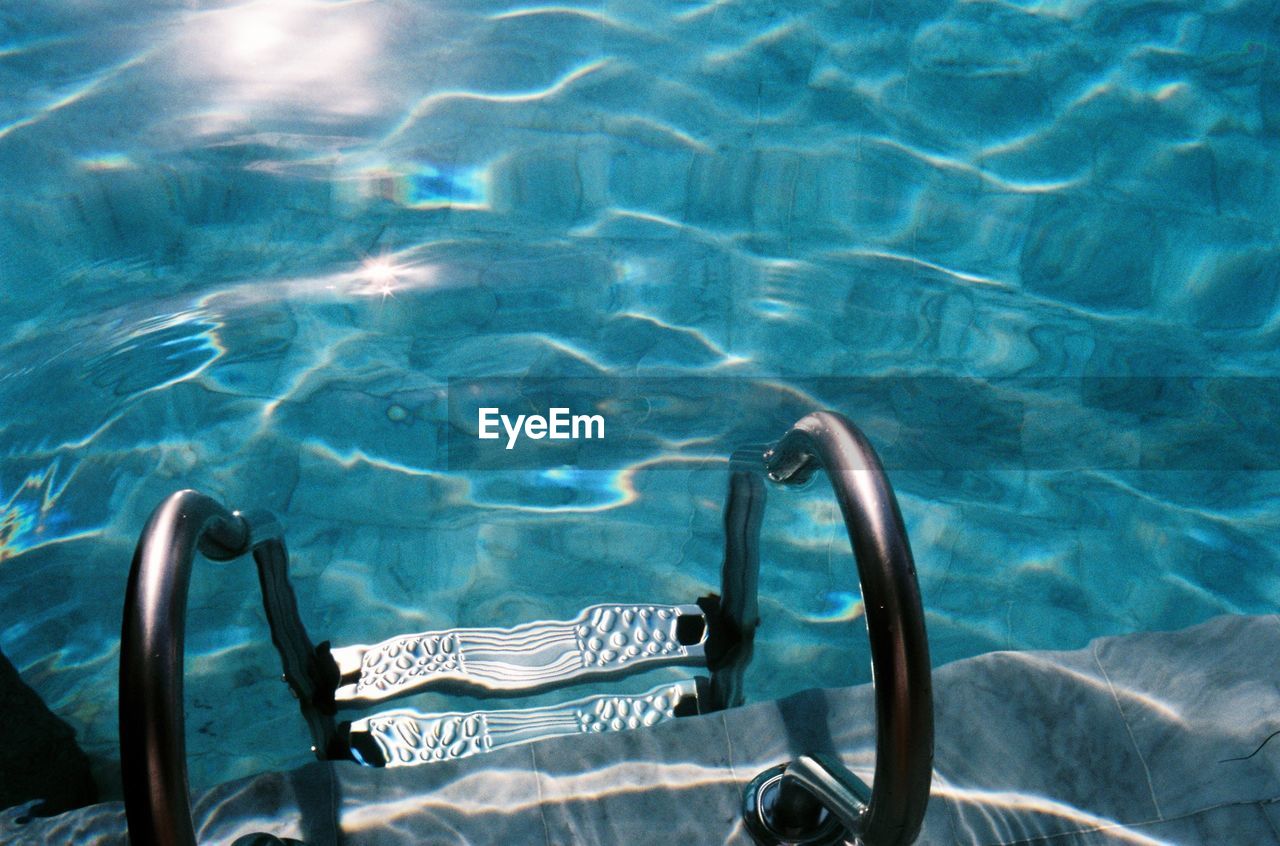 HIGH ANGLE VIEW OF A SWIMMING IN POOL