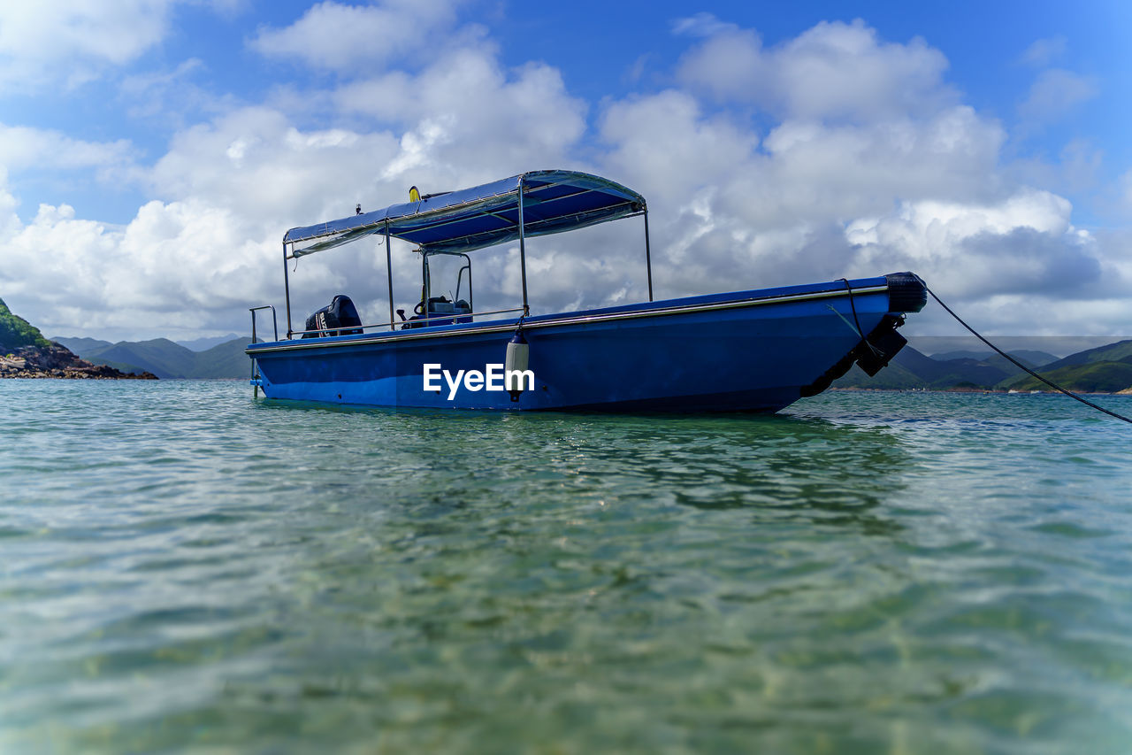 LIFEGUARD BOAT IN SEA AGAINST SKY