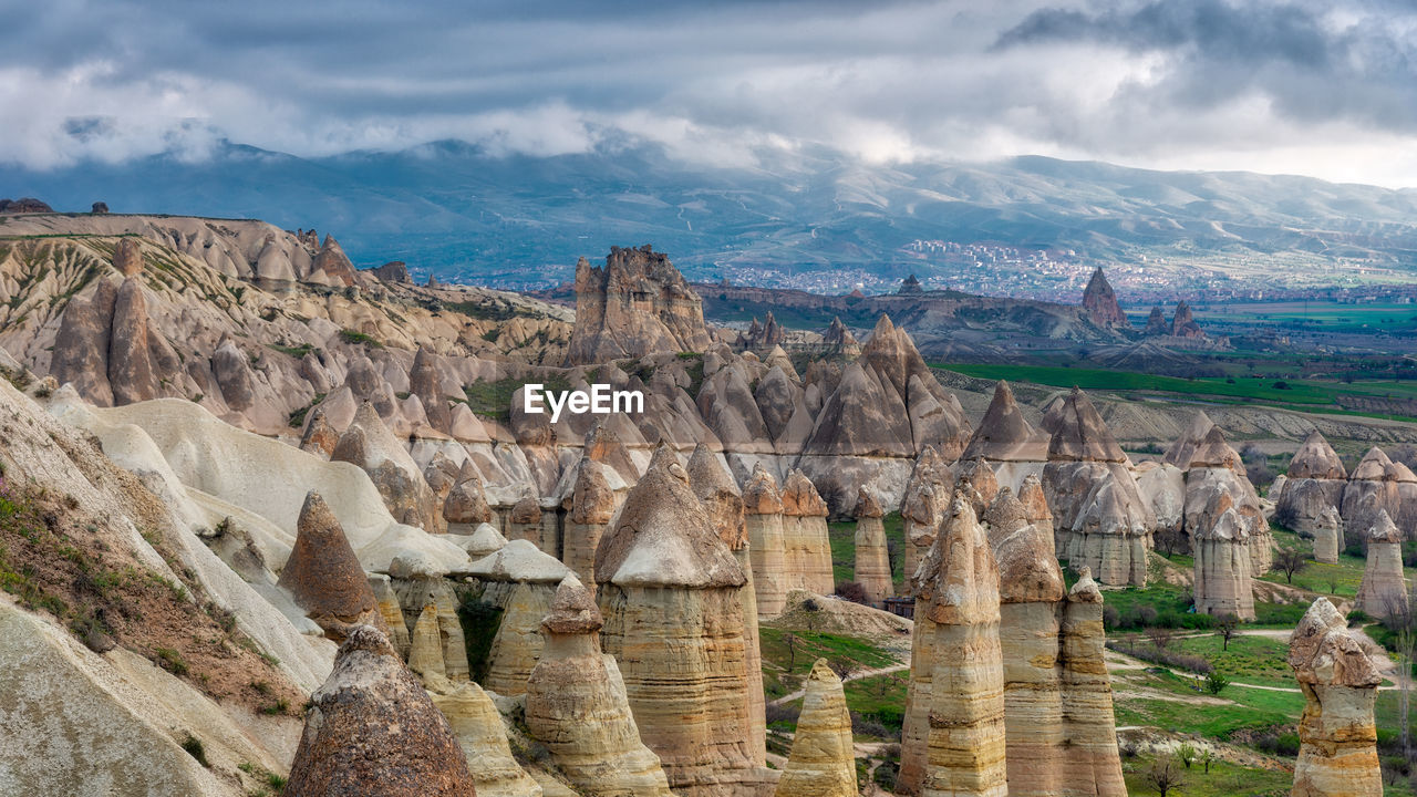 Scenic view of mountain against cloudy sky