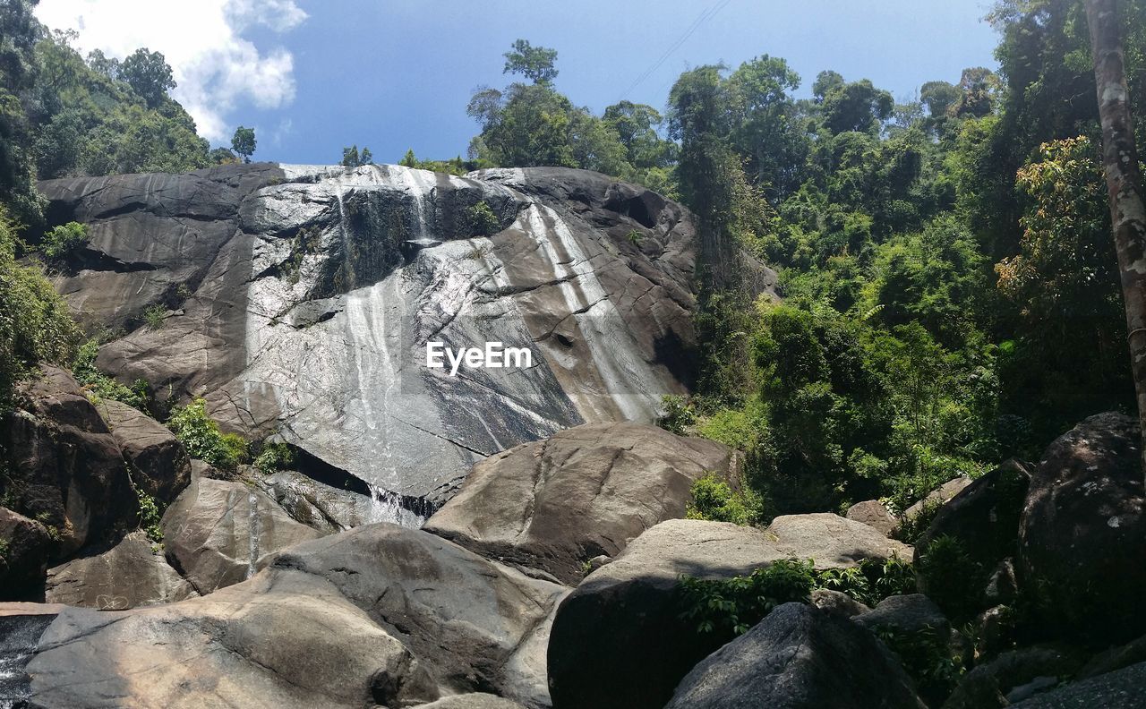 PANORAMIC SHOT OF WATERFALL AGAINST SKY