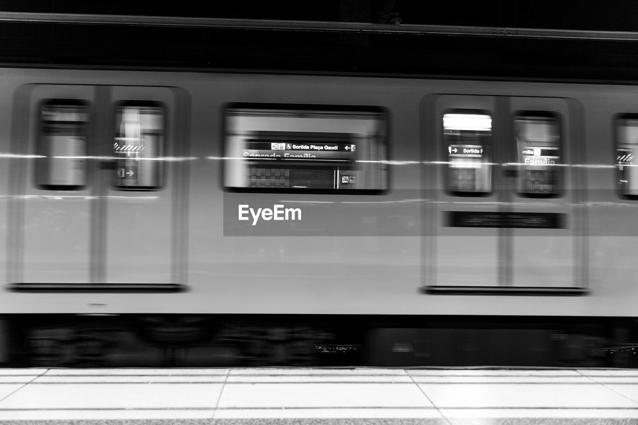 TRAIN AT ILLUMINATED RAILROAD STATION