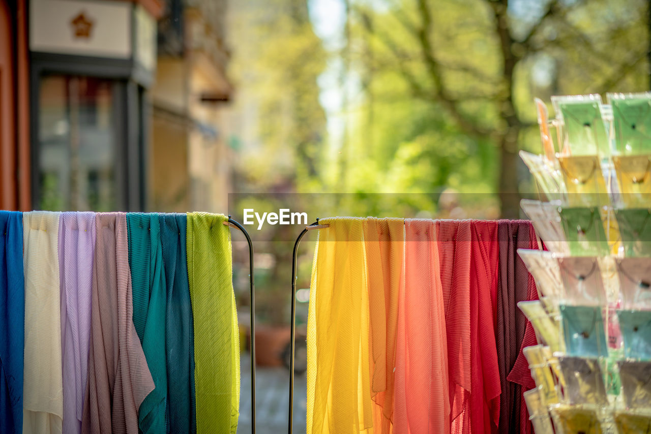 Close-up of textiles hanging on railings