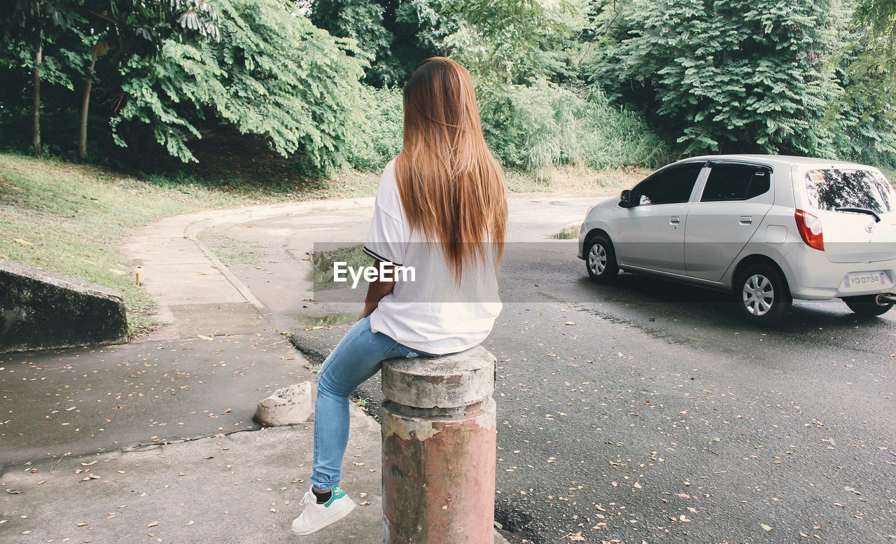 PERSON STANDING ON ROAD