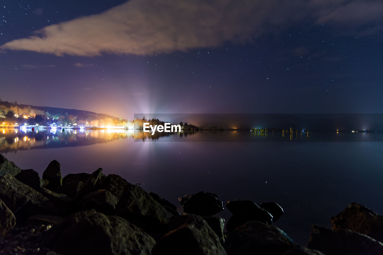 Scenic view of sea against sky at night