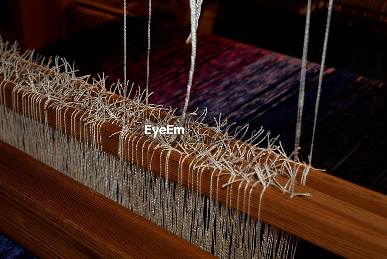 Close-up of loom at textile industry