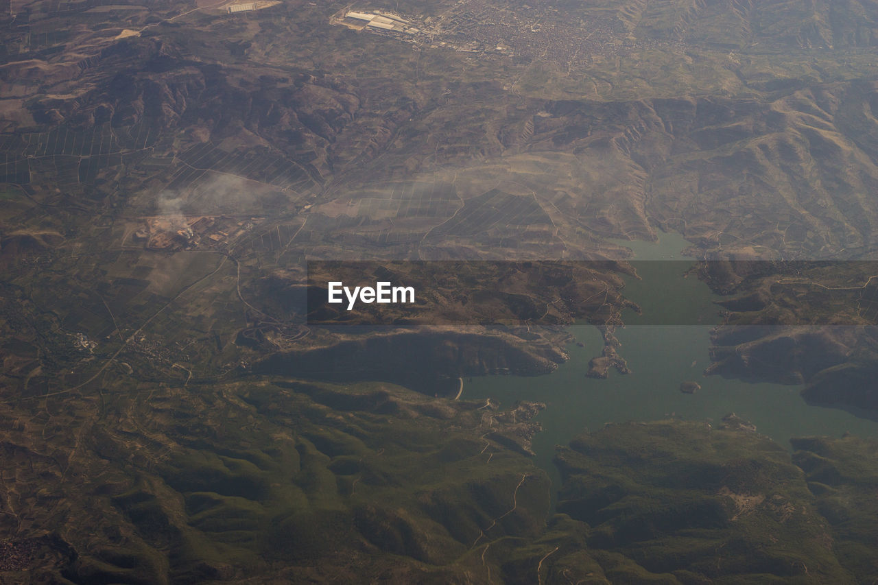 HIGH ANGLE VIEW OF LAND AND WATER